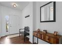 Inviting entryway features a wooden bench, console table, and a decoratively framed mirror at 16566 Branham Dr, Fishers, IN 46040