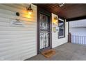 Inviting front porch with a decorative security door and a 'Welcome' mat at 2023 Shelby St, Indianapolis, IN 46203