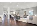 Open concept living space with hardwood floors, seamless flow to kitchen, and ample natural light at 2352 N College Ave, Indianapolis, IN 46205