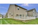 Spacious backyard with a white fenced deck offers a relaxing outdoor retreat at 2468 Shadow Bend Dr, Columbus, IN 47201