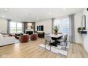 Open-concept living room seamlessly flows into the dining area, great for entertaining at 2634 Penn Ave, Plainfield, IN 46168