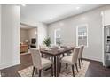 Elegant dining room with a wooden table and seating for six, adjacent to the kitchen at 2748 Carrollton Ave, Indianapolis, IN 46205