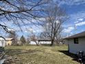 Spacious backyard with bare trees and a view of neighboring houses; great potential for outdoor activities and landscaping at 3314 Argyle Ct, Indianapolis, IN 46226