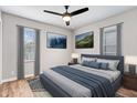 Cozy bedroom showcasing a modern bed with plush bedding, stylish decor, and ample natural light at 3445 N Olney St, Indianapolis, IN 46218