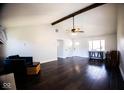 Spacious living room with wood floors, vaulted ceiling, bright light, and fresh, neutral paint at 511 Windward Ln, Plainfield, IN 46168