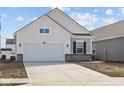 Charming single-Gathering home featuring a two-car garage and light color scheme at 5207 Rolling Meadow Blvd, Indianapolis, IN 46237