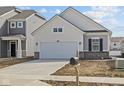 Charming single-Gathering home featuring a two-car garage and light color scheme at 5207 Rolling Meadow Blvd, Indianapolis, IN 46237