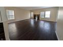 Bright and spacious living room featuring a fireplace, large windows, and stylish flooring at 5565 Noble Dr, Indianapolis, IN 46234