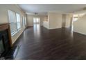 Expansive living area with fireplace, multiple windows, and seamless flow to other living spaces at 5565 Noble Dr, Indianapolis, IN 46234