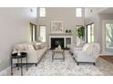 Bright living room with a fireplace, high ceilings, and a comfortable seating area at 797 Crossbridge Ct, Avon, IN 46123