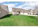 Charming single-Gathering home with well-manicured lawn and a two-car garage at 9539 Rocky Shore Dr, McCordsville, IN 46055