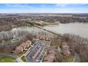 Breathtaking aerial view of lakeside condos, showcasing a serene waterfront setting and convenient access to the lake at 108 Knoll Ct # A, Noblesville, IN 46062
