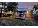 Landscaped backyard with patio seating area, perfect for outdoor entertaining and relaxation at 112 S Spencer Ave, Indianapolis, IN 46219