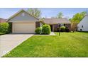 Lovely single-story home featuring an attached garage and a lush, green front lawn at 12741 Glengary Dr, Fishers, IN 46038