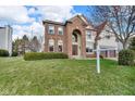 Beautiful brick home features a manicured lawn and attached two-car garage at 250 W Tansey Crossing, Westfield, IN 46074