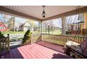 Cozy front porch with a swing, overlooking the street and landscaping at 331 W State St, Pendleton, IN 46064