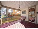 Inviting front porch with a swing, perfect for relaxing and enjoying the neighborhood views at 331 W State St, Pendleton, IN 46064