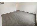 This bedroom boasts a neutral palette and plush gray carpeting at 3662 Lombardy Pl, Indianapolis, IN 46226