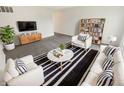 Bright living room with hardwood floors, modern furniture, and open layout is great for entertaining or relaxation at 3662 Lombardy Pl, Indianapolis, IN 46226