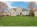 Charming front exterior of a two-story home with brick facade, manicured lawn, and curb appeal at 3892 Pelham Rd, Carmel, IN 46074
