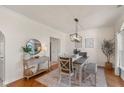 Stylish dining room with hardwood floors, contemporary lighting, and charming decor at 4801 Copper Grove Dr, Indianapolis, IN 46237