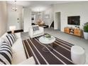Bright living room featuring a modern interior design, comfortable seating and neutral colors at 5927 Timber Lake Blvd, Indianapolis, IN 46237