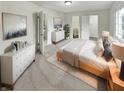 Serene main bedroom featuring neutral decor, ample natural light, and multiple entry points at 5927 Timber Lake Blvd, Indianapolis, IN 46237