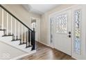 Inviting entryway with hardwood floors, decorative glass front door, and staircase at 788 S Harbour Dr, Noblesville, IN 46062
