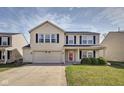 Charming two-story home features a two-car garage, well-maintained lawn, and classic architectural details at 8316 S Swimming Hole Ln, Pendleton, IN 46064