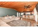 Open-concept space with a cozy living room flowing into a breakfast bar and kitchen at 8829 Depot Dr, Indianapolis, IN 46217
