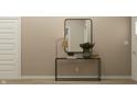 Contemporary entryway with a modern console table, mirror, and stylish decor at 19727 Boulder Brook Ln, Westfield, IN 46074