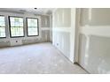 Unfinished bedroom featuring natural light, black window frames and neutral paint at 20598 Chatham Creek Dr, Westfield, IN 46074