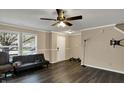 Inviting living room featuring wood floors, a cozy couch, and natural light from the large windows at 2180 Olympia Dr, Franklin, IN 46131