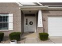 Close up of a home's front door with a wreath and decorative columns at 462 N Crystal Dr, Fortville, IN 46040