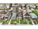 An aerial view of a home nestled in a neighborhood with mature trees and well-kept lawns at 4933 Ford St, Indianapolis, IN 46224