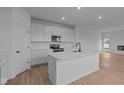Modern kitchen with white cabinets, stainless steel appliances, and a central island at 5211 Rolling Meadow Blvd, Indianapolis, IN 46237