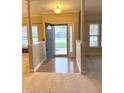 Inviting foyer with hardwood floors and an open entryway, offering a welcoming entrance into the home at 10072 Graceful Landing Dr, Indianapolis, IN 46234