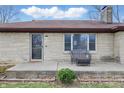 Close up of the facade and porch with stone and a cozy chair to sit and relax on at 1114 S Avon Ave, Avon, IN 46123