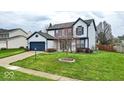 Beautiful two-story home with well-maintained landscaping and inviting curb appeal at 12555 Wolford Dr, Fishers, IN 46038