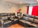 Inviting living room with modern decor, laminate flooring, and stylish furniture at 1921 W Michigan St, Indianapolis, IN 46222