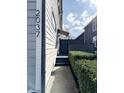 Property side view showing walkway and privacy fencing at 2037 Ruckle St, Indianapolis, IN 46202