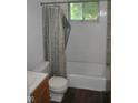 Bathroom featuring a bathtub with a shower curtain and a small window at 2194 N Riley Ave, Indianapolis, IN 46218