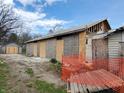 Exterior view of a plywood-covered home under construction, with detached garage at 2860 S Rybolt Ave, Indianapolis, IN 46241