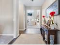 Bright foyer with hardwood floors that flows into a living room at 4148 Basswood Dr, Danville, IN 46122