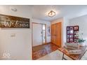 Welcoming foyer with tile flooring and wood accents at 802 Burwick Trce, Greenwood, IN 46143