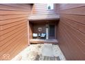 Inviting front porch with seating and a 'Welcome' sign at 802 Burwick Trce, Greenwood, IN 46143