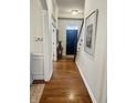 Home foyer featuring hardwood floors, a staircase, and a view of the front door at 12652 Meeting House Rd, Carmel, IN 46032