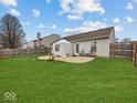 Large backyard with a patio and privacy fence, perfect for outdoor entertaining at 1683 Sweetwater Ln, Greenfield, IN 46140