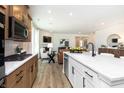 Open-concept kitchen with island offers stainless steel appliances and seamless flow into the living area at 16955 Cole Evans Dr, Noblesville, IN 46060