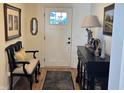 Inviting entryway featuring hardwood floors, elegant furnishings, and decorative artwork at 2460 Collins Dr, Westfield, IN 46074